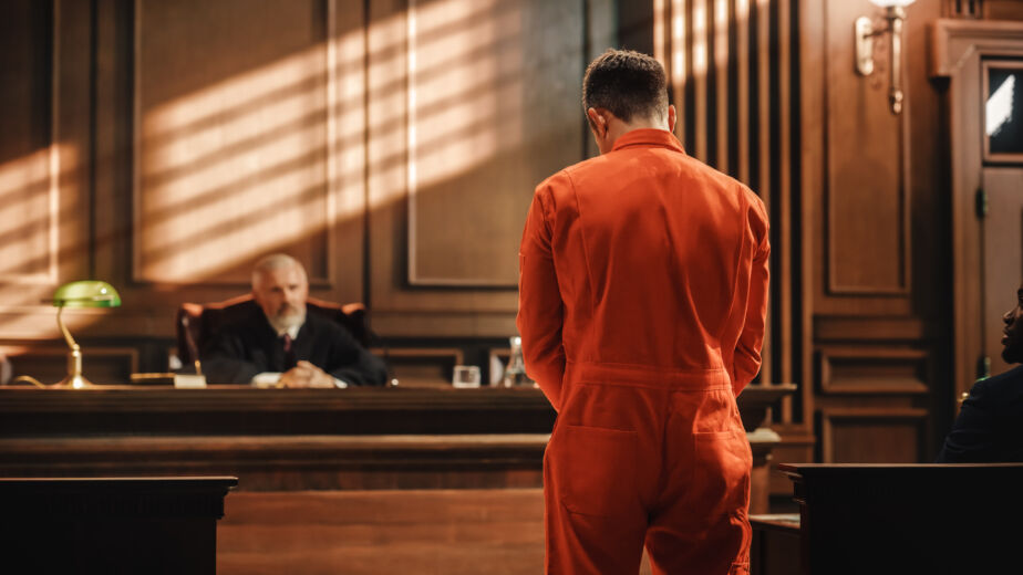 Court of Law and Justice Trial Proceedings Law Offender in Orange Jumpsuit is Questioned and Giving Testimony to Judge Jury Criminal Denying Charges Pleading Inmate Denied Parole Rob Doar Law Rob Doar Law