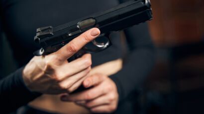 Woman getting ready for a shooting drill