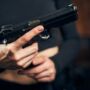 Woman getting ready for a shooting drill