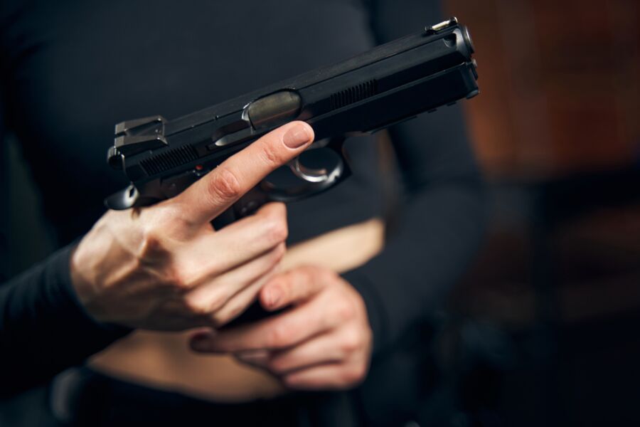 Woman getting ready for a shooting drill